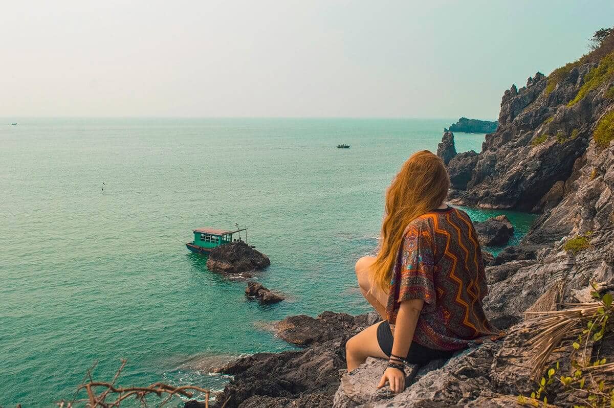 tasha amy looking over fisherman in lan ha bay best things to do in vietnam