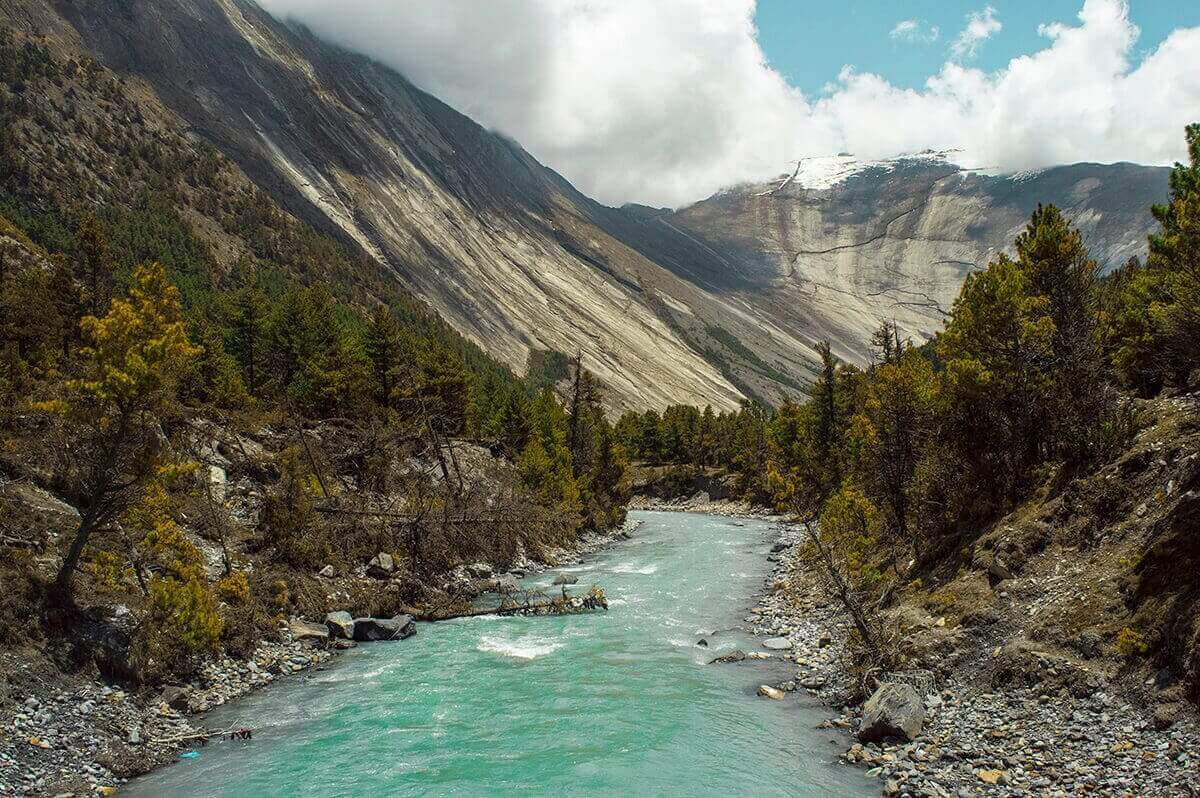 flowing river chame to upper pisang annapurna circuit