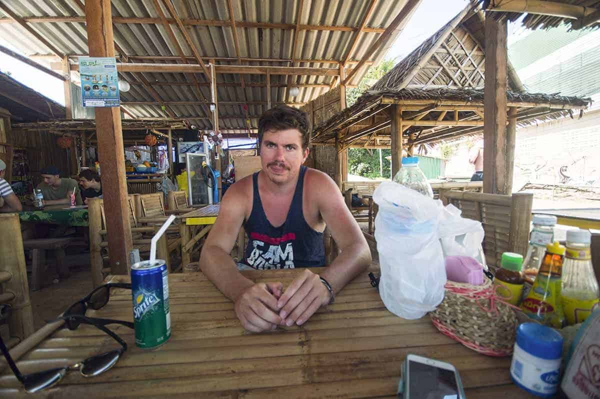 eating at a local restaurant in koh phangan which has bamboo tables