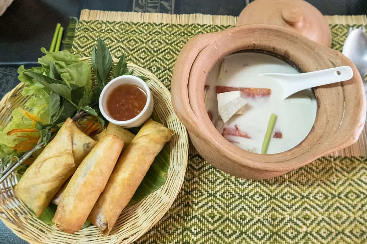 coconut tofu soup with spring rolls in the vegetarian cooking class in chiang mai