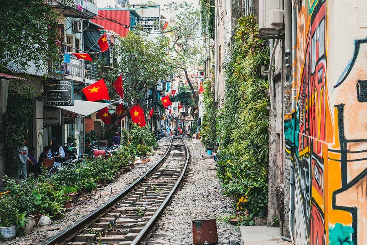 train street in hanoi with cafes lined up along the sides