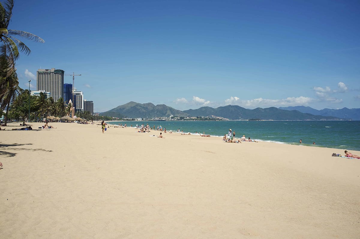 Best Beaches In Nha Trang Worth Visiting In 2023 16 people enjoying the sea at nha trang beach