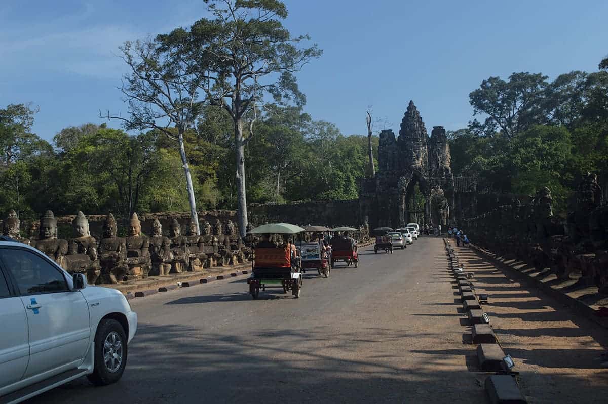 traffic on the angkor wat small circuit going through one of the gates to angkow thom