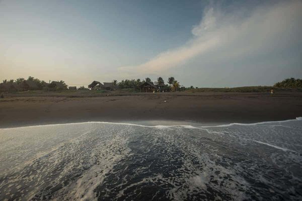 El Paredon For Budget Travelers: Is It Worth Visiting? 8 enjoying the waves at el paredon in guatemala just in front of the driftwood surfer hostel