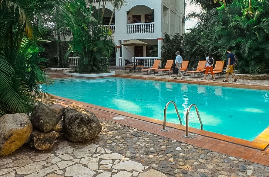 relaxing by pool at the camino maya hotel is a must on a hot day