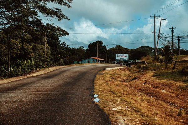 driving along the road from belize city to san ignacio