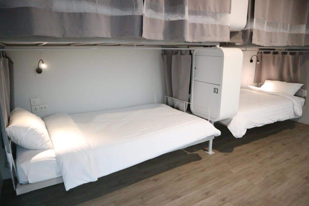 comfortable beds with fluffy blankets at bedspread hostel