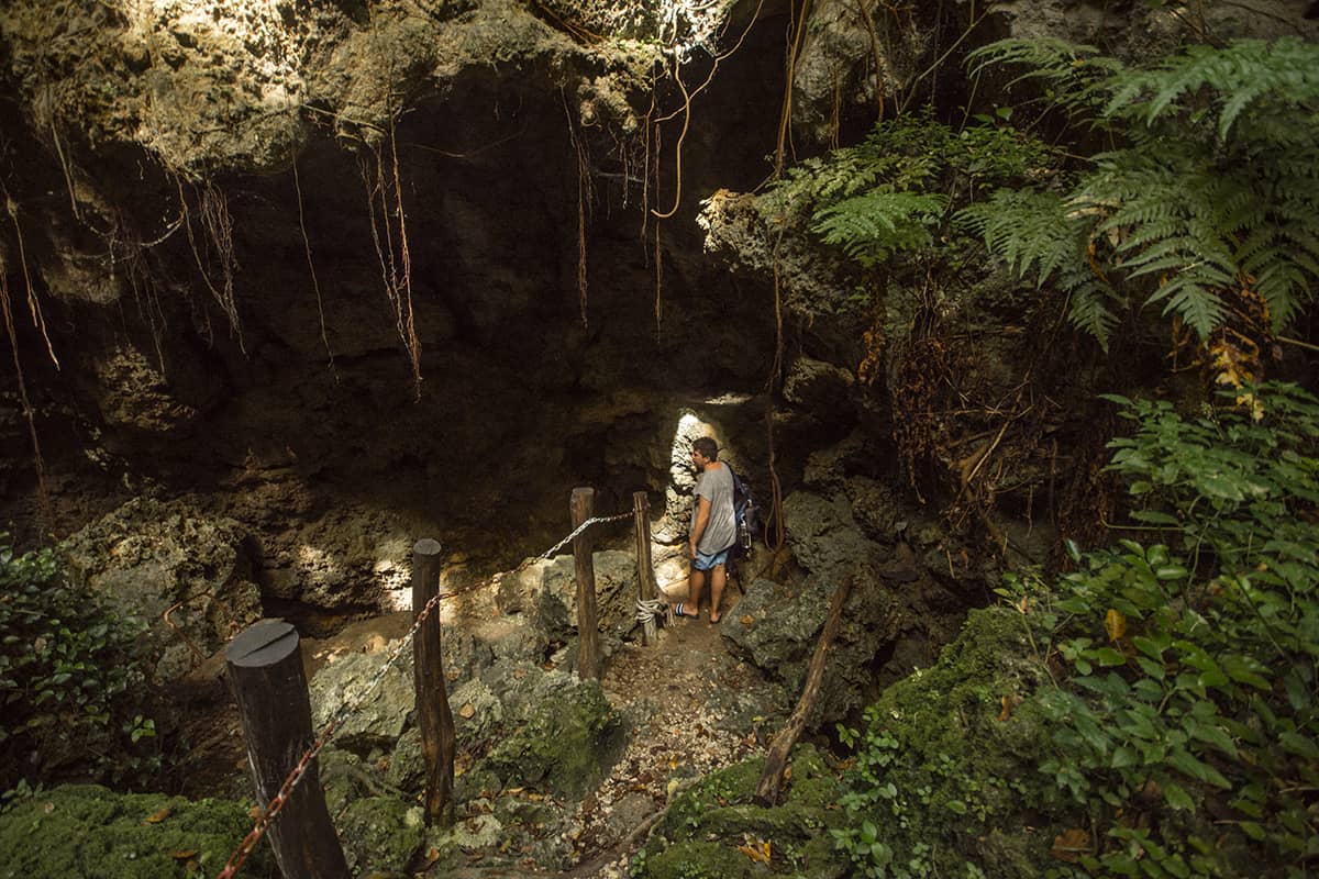 entering the secret grotto in lifou by venturing underground