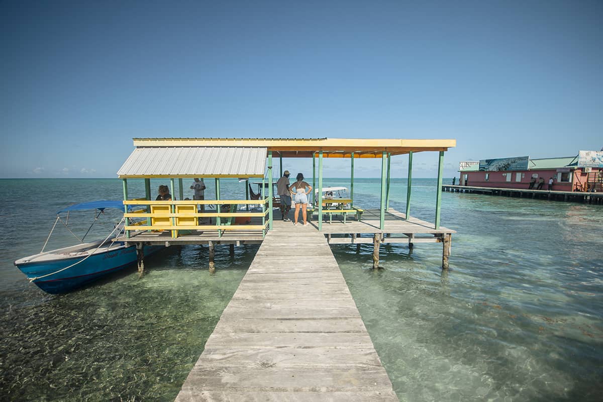 Backpacking Caye Caulker In Belize: Top Travel Tips 12 walking along one of the piers in caye caulker