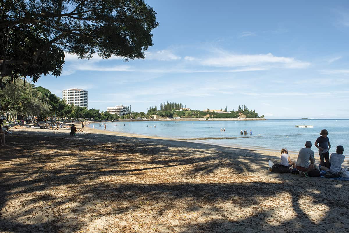 Cruise Port Noumea: What To Know And Best Things To Do 17 families hanging out at the beach of baie des citrons