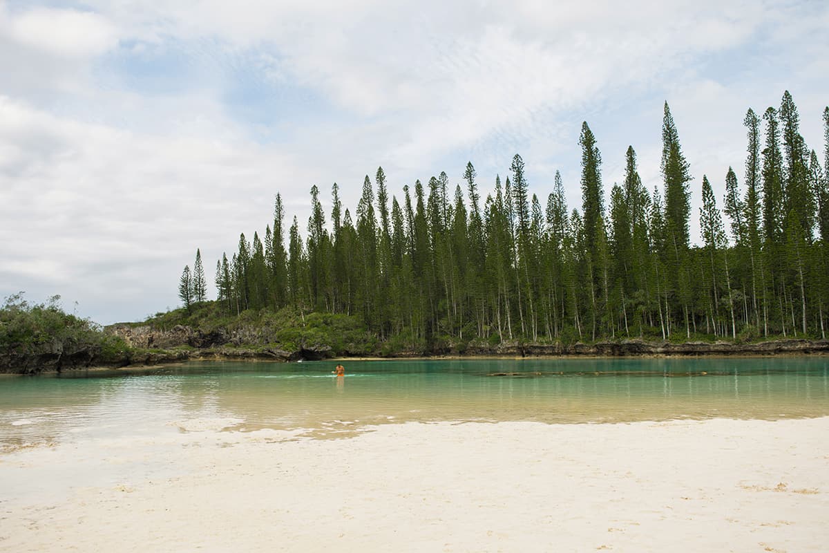 Isle Of Pines Natural Pool: Why You NEED To Visit 2023 34 the small rocky coral sections of reef are visible through the crystal clear water