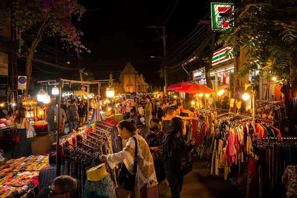 Sunday Night Market In Chiang Mai: Best Market In Thailand (2023) 27 crowds and clothing stalls outside seven eleven at the chiang mai sunday night market