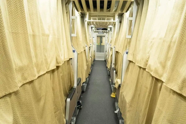 curtains pulled shut on the overnight sleeper train from bangkok to chiang mai