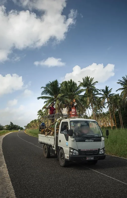 Port Vila Blue Lagoon: BEST Tips For Visiting 2026 10 locals waving out the back of a pick up truck while we were broken down on the side of the road in port vila vanuatu