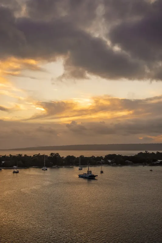 Port Vila Blue Lagoon: BEST Tips For Visiting 2026 12 a beautiful sunset with numerous yachts while departing port vila on our cruise ship