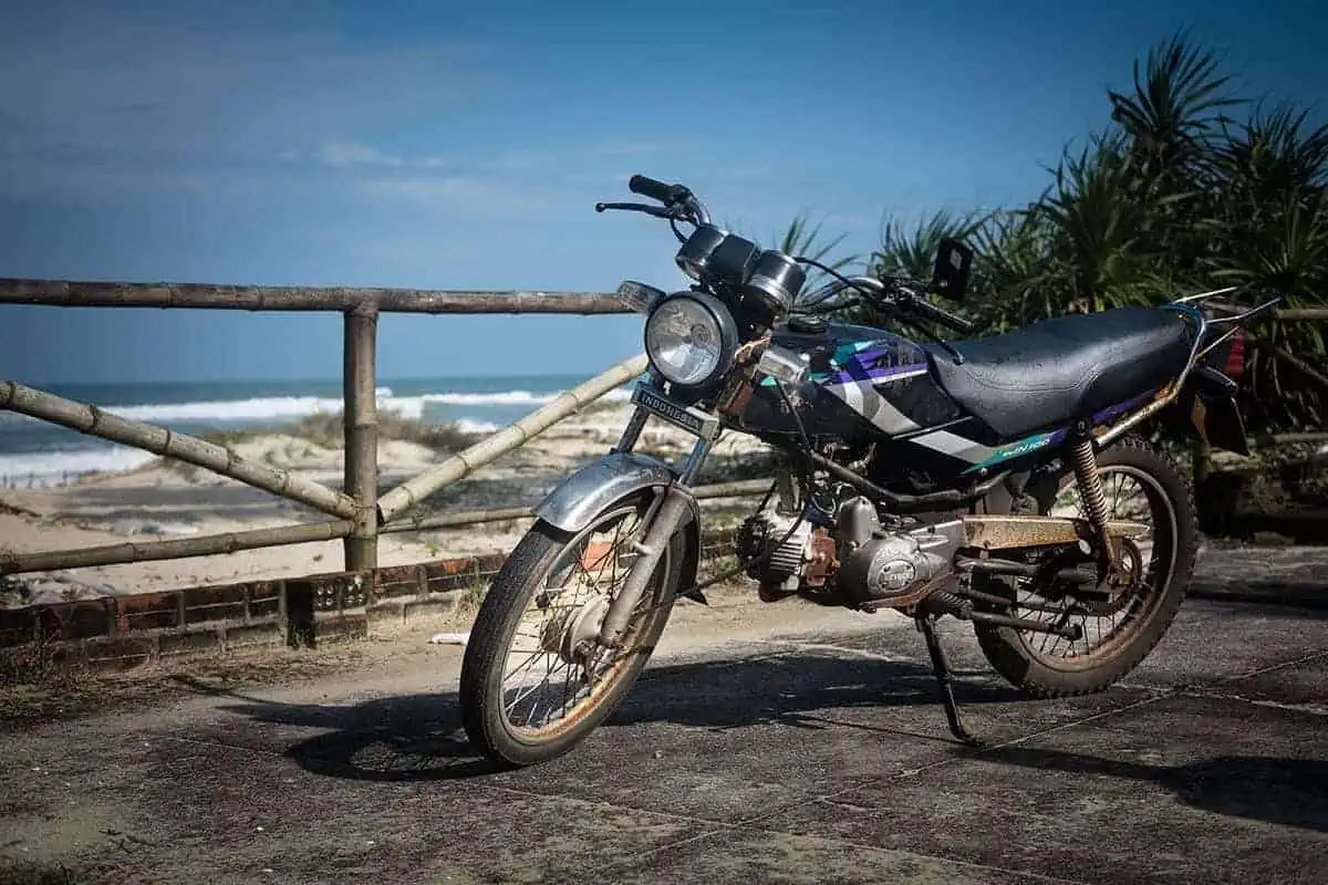 a travelers motorbike along the beach in vietnam