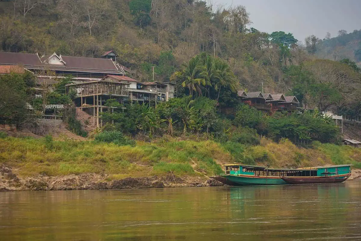 Taking The Slow Boat To Luang Prabang: BEST Tips 2023 14 first sights of the township of pakbeng from our slow boat