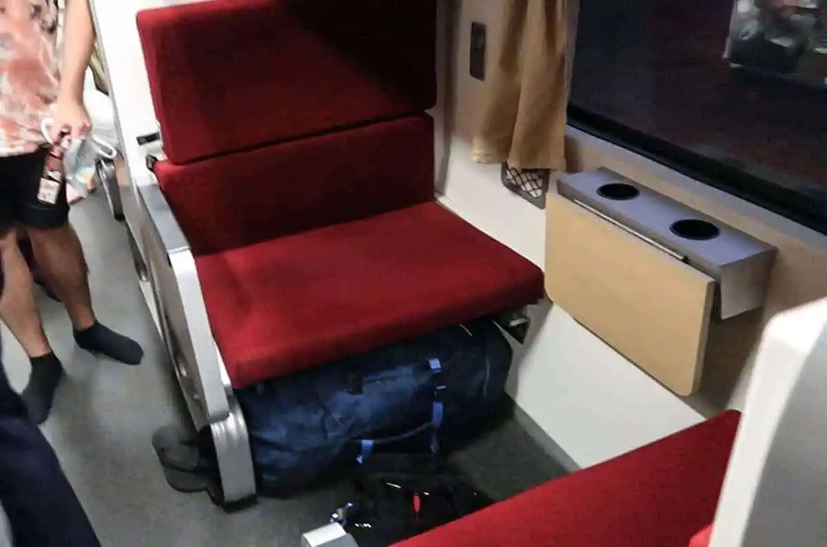 typical seating arrangement on the sleeper train to chiang mai with the seats folding down into a bed