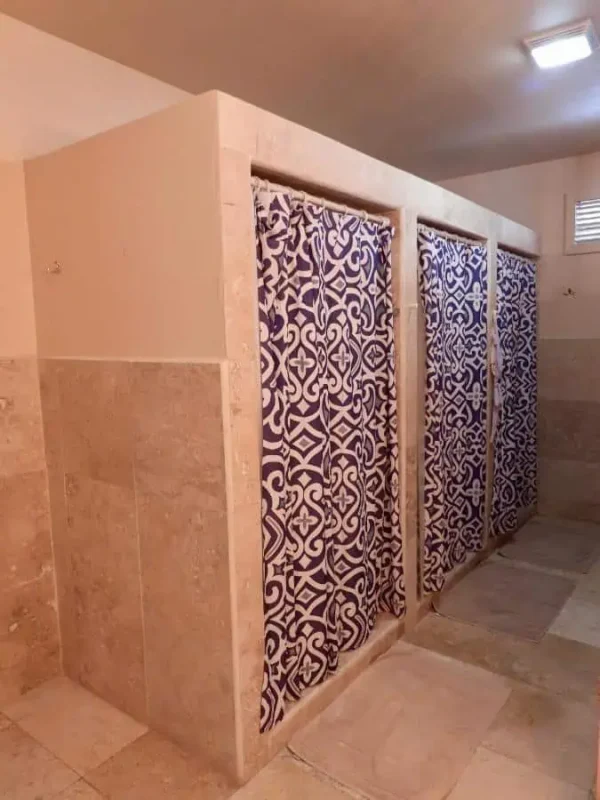 clean and modern bathrooms at sandbar beachfront hostel in san pedro
