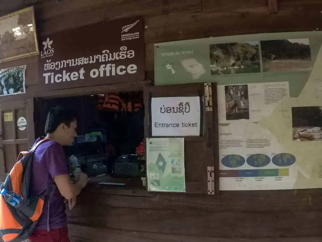 Kong Lor Cave, Laos: ULTIMATE Guide (2026) 37 purchasing our entry ticket to konglor cave in laos