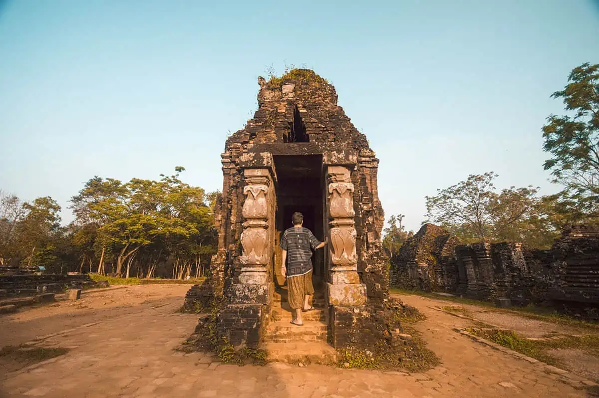 My Son Sanctuary Hoi An: BEST Tips & Tours (2026) 1 climbing a temple at my son sanctuary hoi an vietnam