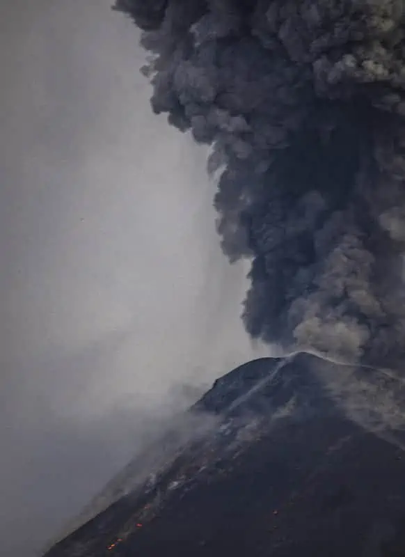 Acatenango Volcano Hike Difficulty: My Honest Experience 22 the sky turning dark with rocks and ash flying around during an eruption