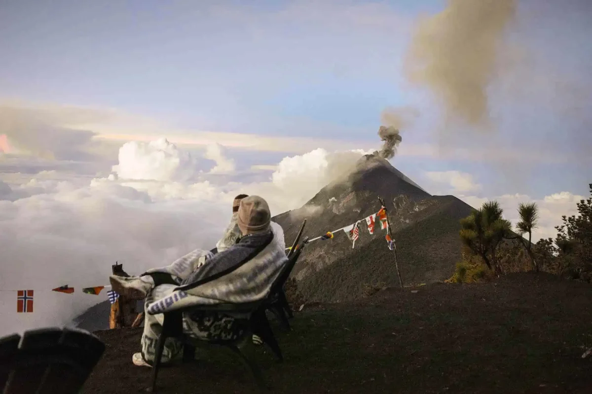 Acatenango Volcano Hike Difficulty: My Honest Experience 41 wrapped up in warm blankets watch fuego volcano erupt on a chilly morning
