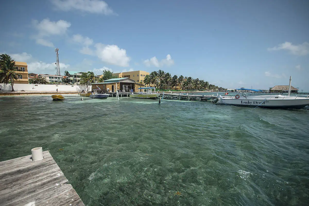 Backpacking Belize: The BEST Guide For Travelers 2026 87 on our ferry from san pedro to caye caulker looking back at the island while backpacking belize