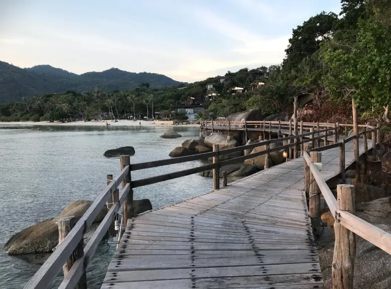 Best Beaches In Koh Phangan: 12 Must-Visit Beaches 50 walking a;long the wooden pathway at dusk on leela beach koh phangan