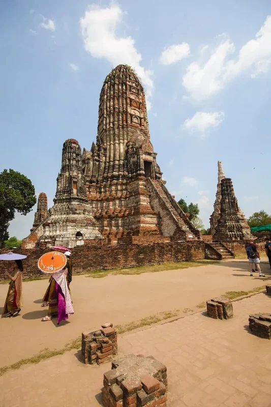 Ayutthaya Day Trip From Bangkok: BEST Guide (2026) 48 local ladies dressed in traditional clothes around Wat Chai Watthanaram prang