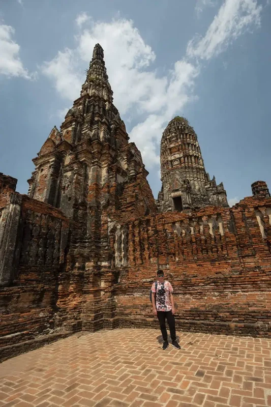 Ayutthaya Day Trip From Bangkok: BEST Guide (2026) 47 a man standing in front of Wat Chai Watthanaram