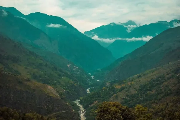 views over mountain and river from bahundanda after a busy day travel from pokhara to besisahar by bus