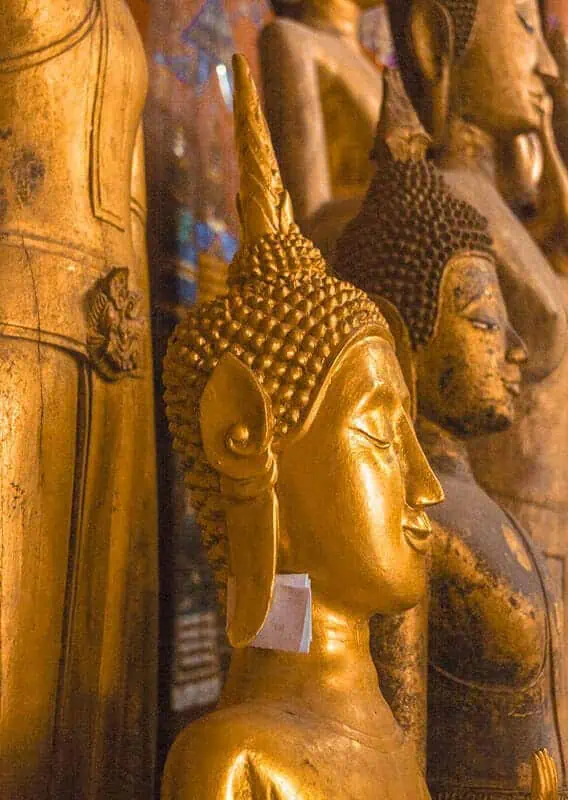 golden buddhas at temple in luang prabang