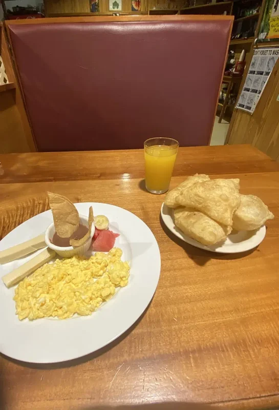 a typical breakfast in belize including fryjacks and refried beans
