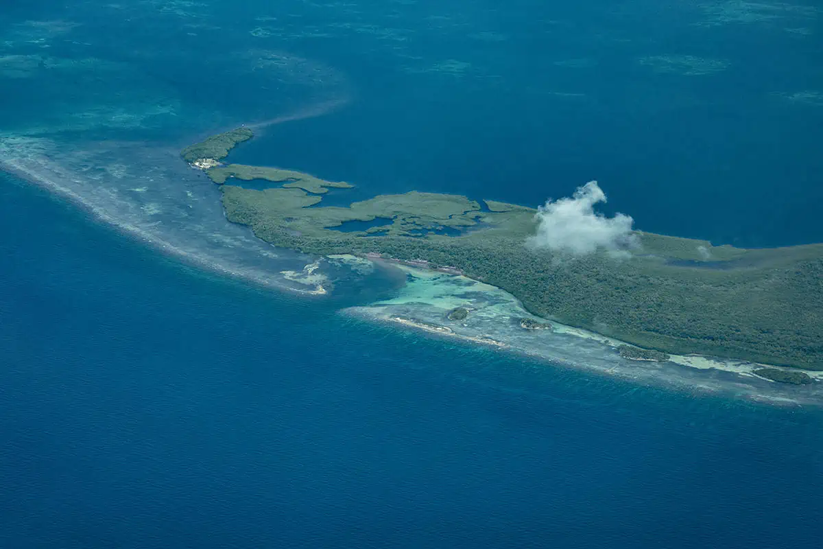 looking down to one of the isolated cayes in belize while flying in