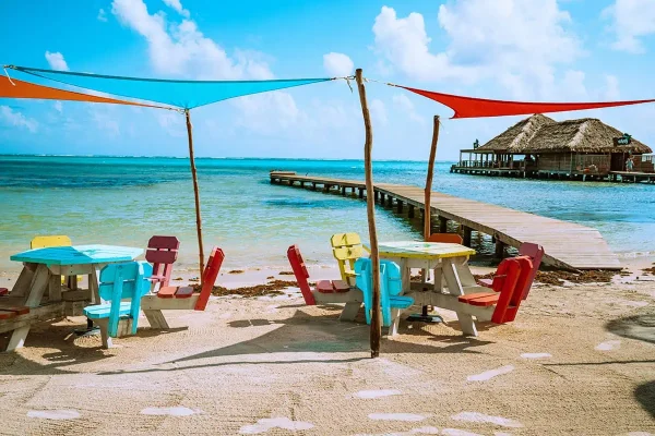 hanging out on the beach knowing the answers as to why visit belize