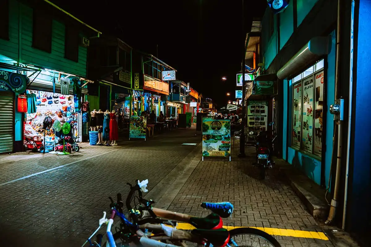 Best Hostels In San Ignacio: 5 Excellent Stays For Travelers On A Budget 64 "Night view of a bustling street in San Ignacio showcasing the vibrant nightlife and cultural scene close to the hostel.