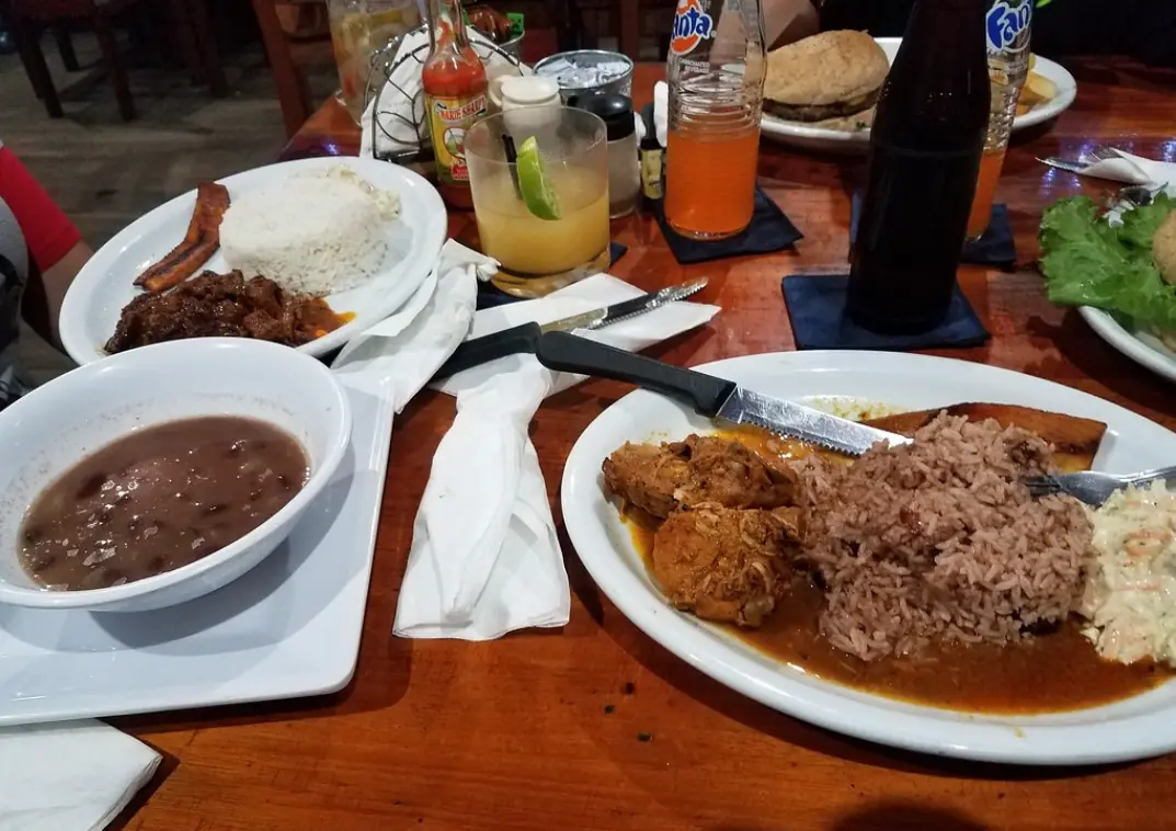 12 Best Restaurants In San Ignacio: Top Eats For Visitors 60 A traditional Belizean meal with stewed meat, rice, beans, and fried plantain, served with refreshing beverages, at ko-ox han nah, a popular eatery in San Ignacio.