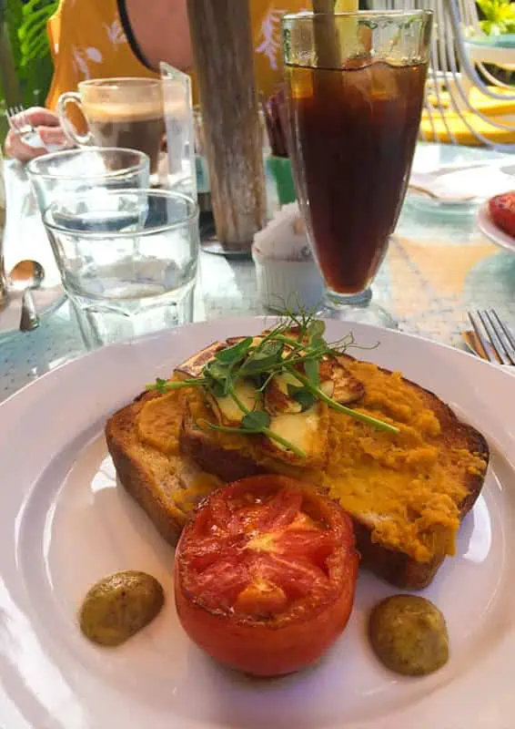 Where To Eat In Rarotonga: BEST Restaurants & Cafes 2026 28 Savory breakfast toast with scrambled eggs and a side of roasted tomato, capturing the essence of lazy trout for a morning meal.