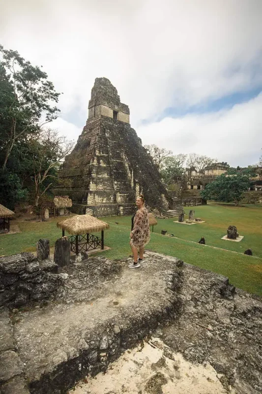 San Ignacio To Tikal & BEST Tikal Tours From San Ignacio 62 Tasha Amy standing in front of a towering temple at Tikal, evidence of the majestic Mayan architecture that can be explored on tours from San Ignacio.