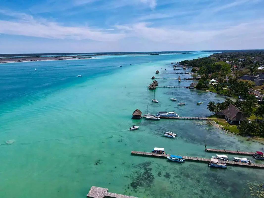 Bacalar To Caye Caulker: The ULTIMATE Travel Guide 2026 8 Aerial view of Bacalar's lagoon with clear waters stretching into the distance. Your starting point on the bacalar to caye caulker journey.