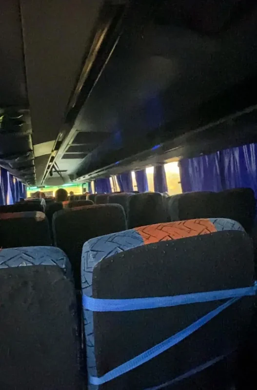 Bacalar To Caye Caulker: The ULTIMATE Travel Guide 2026 62 Interior of a bus with rows of seats and passengers traveling from Bacalar to Caye Caulker.