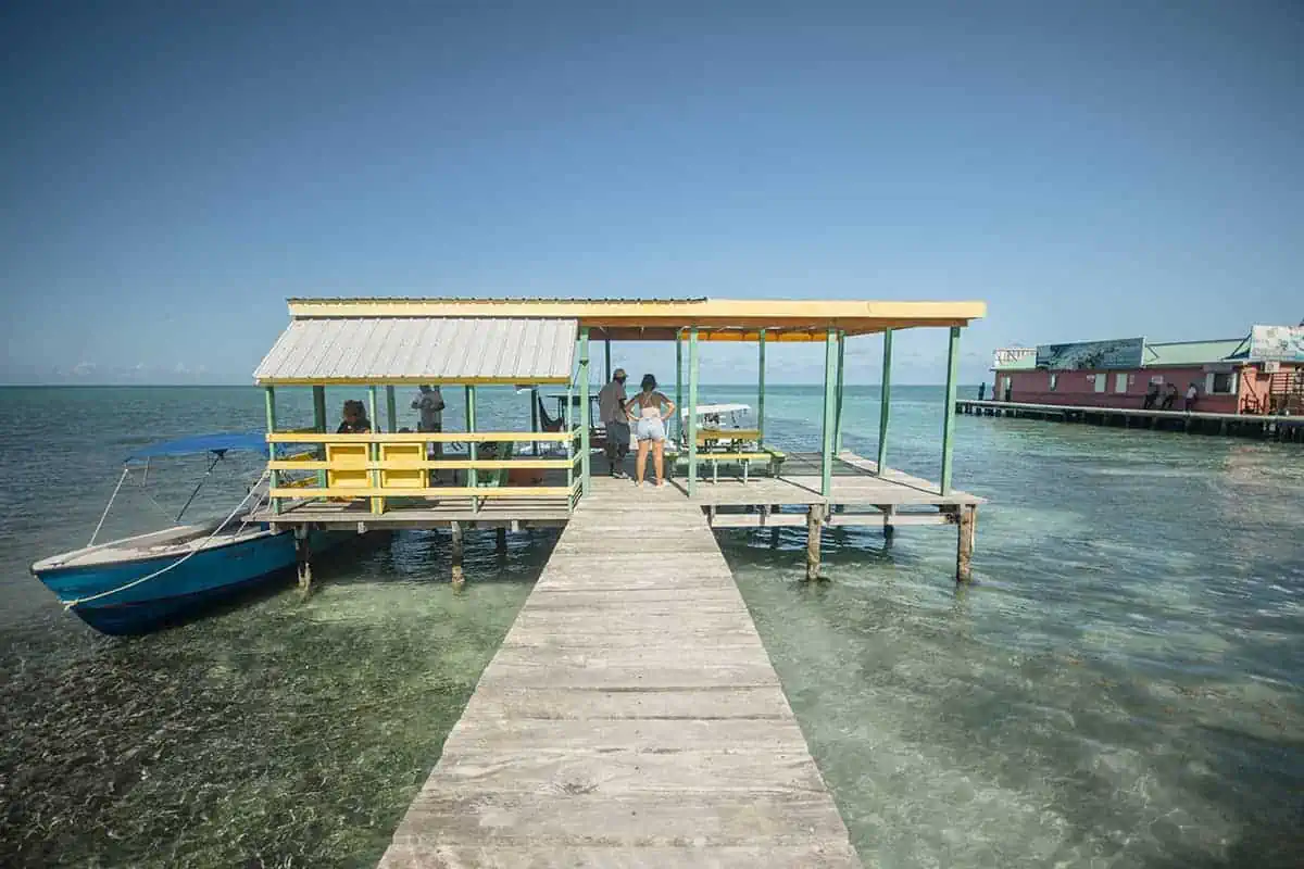 Chetumal To Caye Caulker: Best & Easiest Transport 2026 54 A dock leading to a hut over the sea in Caye Caulker.