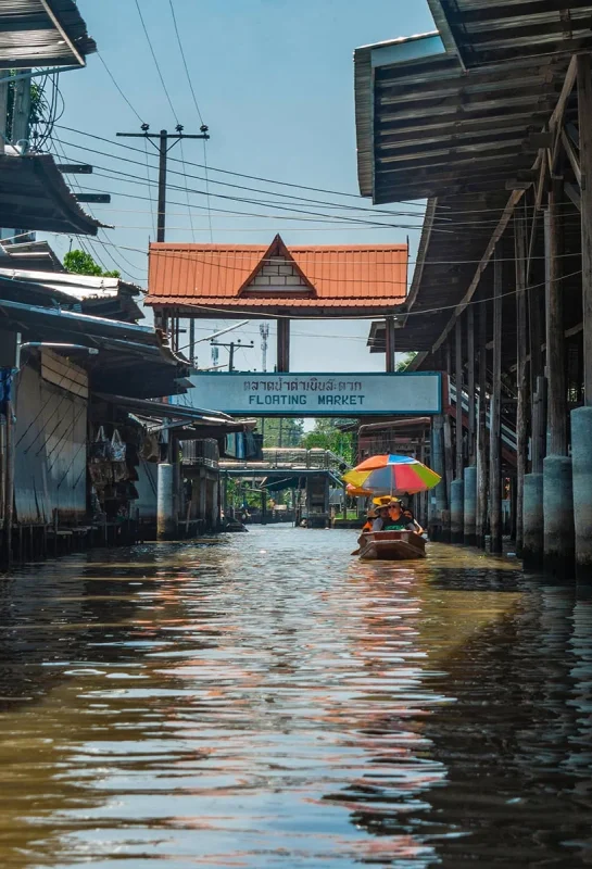 2 Days in Bangkok Itinerary For First-Time Visitors 58 looking down one of the canals to the bridge with the sign floating market in Bangkok