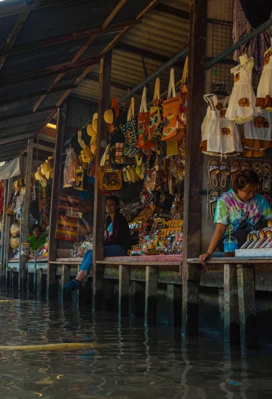 2 Days in Bangkok Itinerary For First-Time Visitors 57 sellers in stalls over the water at the Damnoen Saduak Market, a must on your Bangkok itinerary