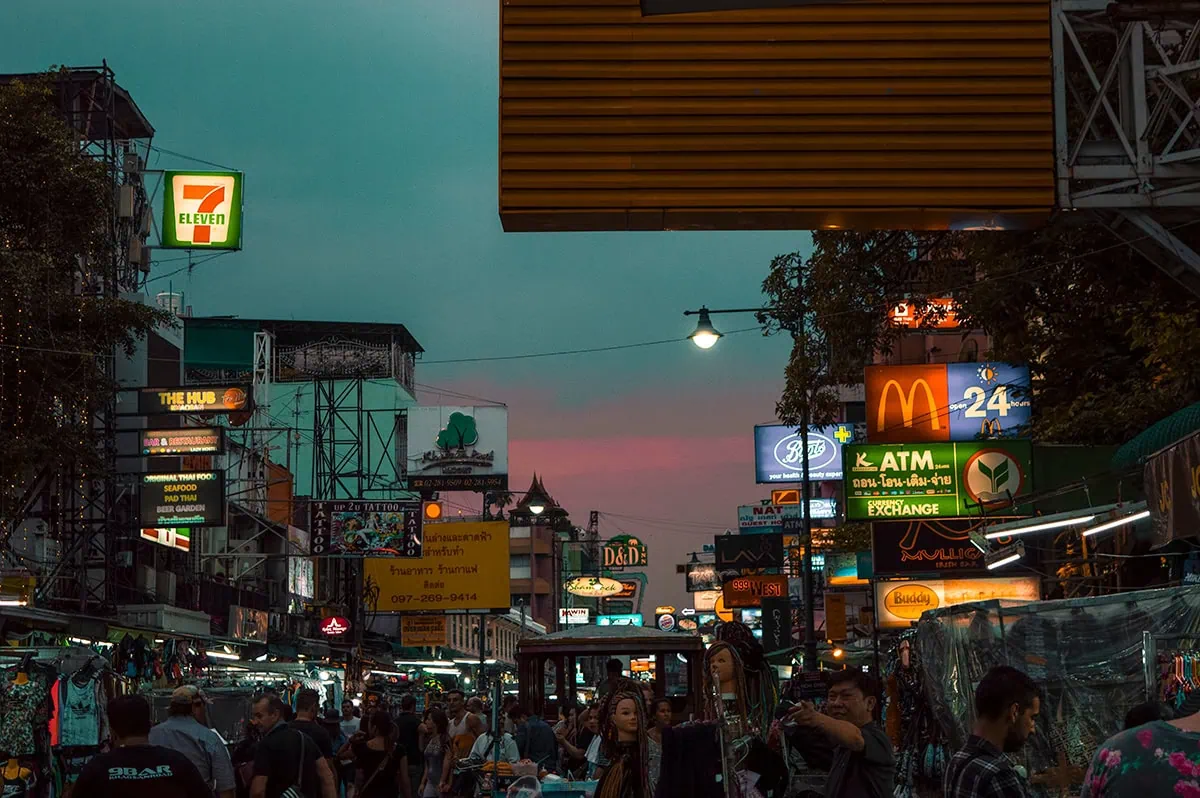 2 Days in Bangkok Itinerary For First-Time Visitors 60 Kaho San Road with neon signs and crowds during sunset in Bangkok