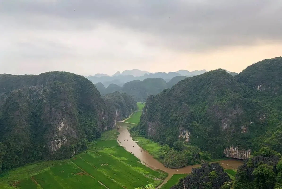 3 Weeks In Vietnam Itinerary: The Perfect First-Time Route 63 View of a river winding through karst limestone mountains in Ninh Binh, Vietnam.