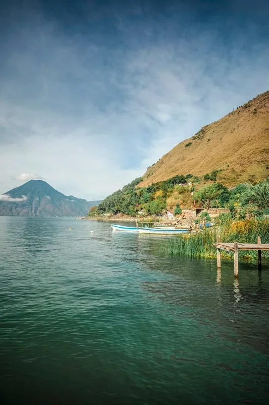 small boats moored up on the shores of Santa Cruz La Laguna in Lake Atitlan