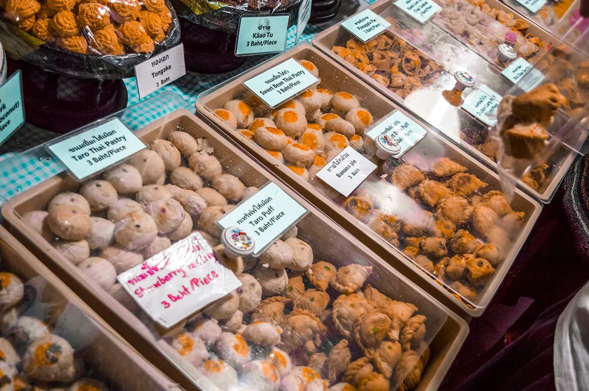 little local sweets displayed in cases at the Sunday Night Market in Chiang Mai, Thailand