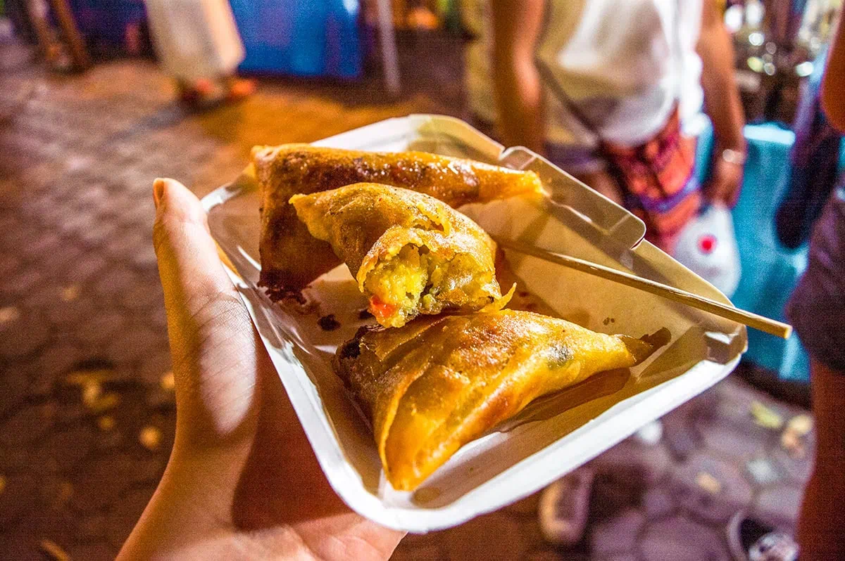 three fried homemade samosas at the Chiang Mai Sunday Market